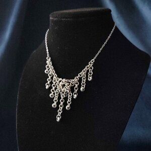 Gothic V-shaped chainmaille necklace with a small silver chain